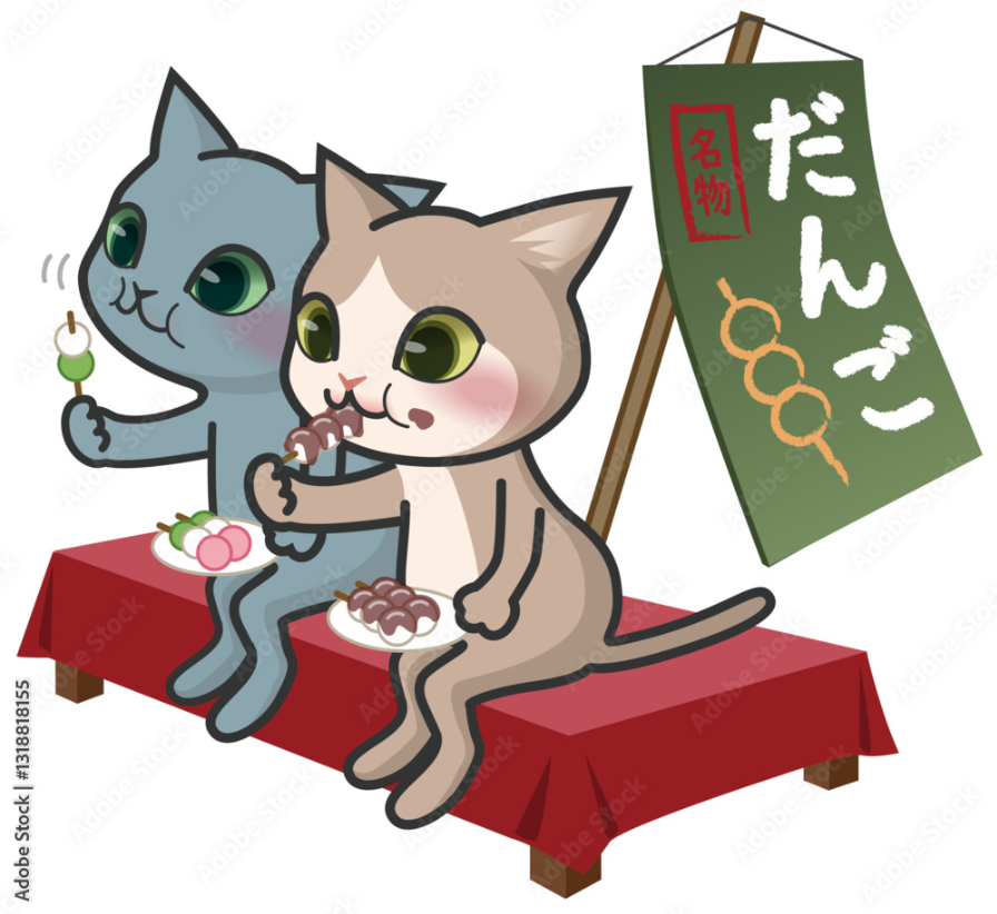 お団子を食べている2匹の猫