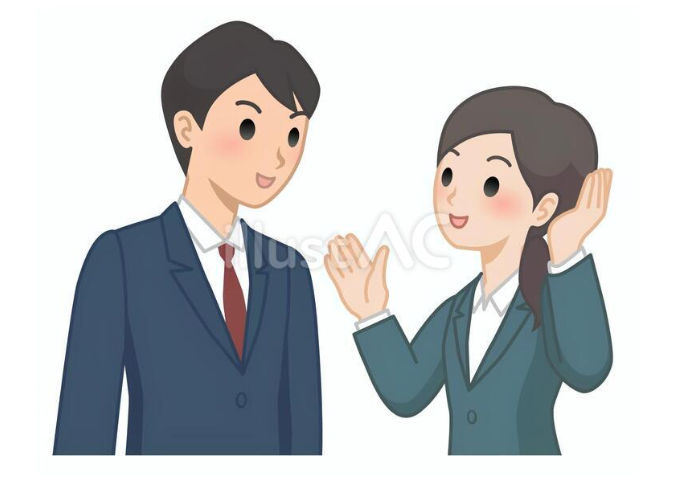 会話をしているスーツを着た男性と女性