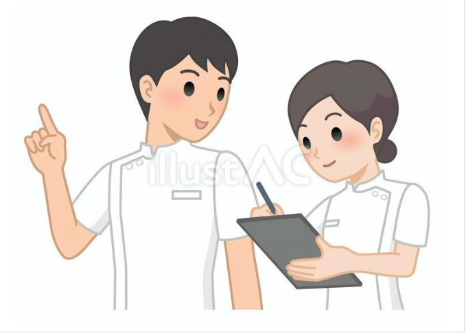 メモを取りながら会話をする医療スタッフ