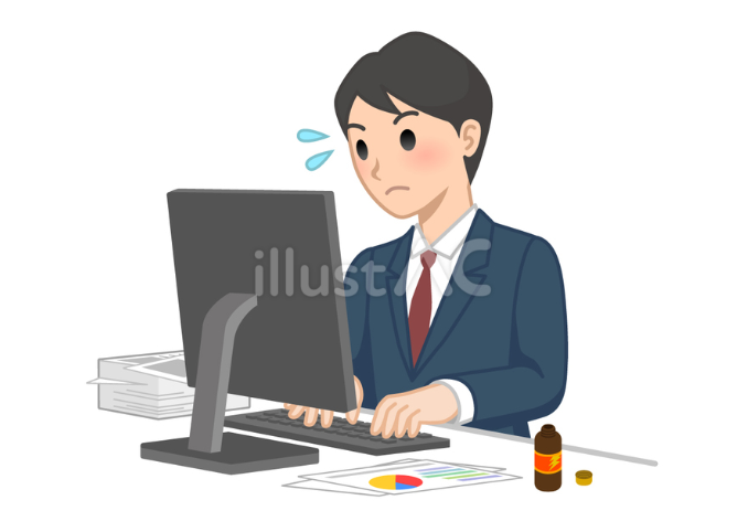 パソコンで大量の仕事をしている男性