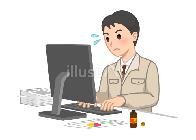 パソコンで大量の仕事をしている作業着の男性